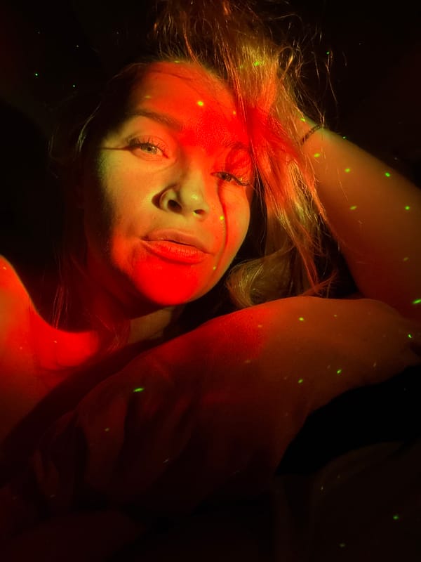 Woman photographed in colored light portrait session in Veliky Novgorod