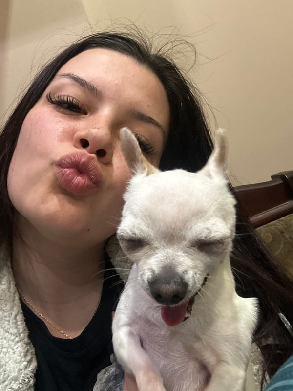 Woman poses for affectionate photos with small dog in Bulgaria