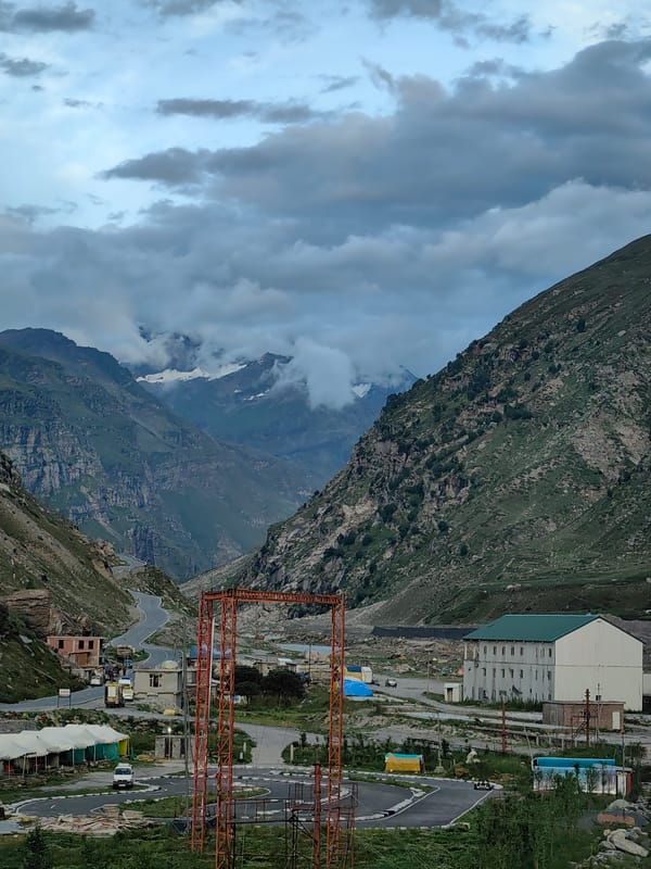 Prayer flags and river views along a Himachal mountain highway