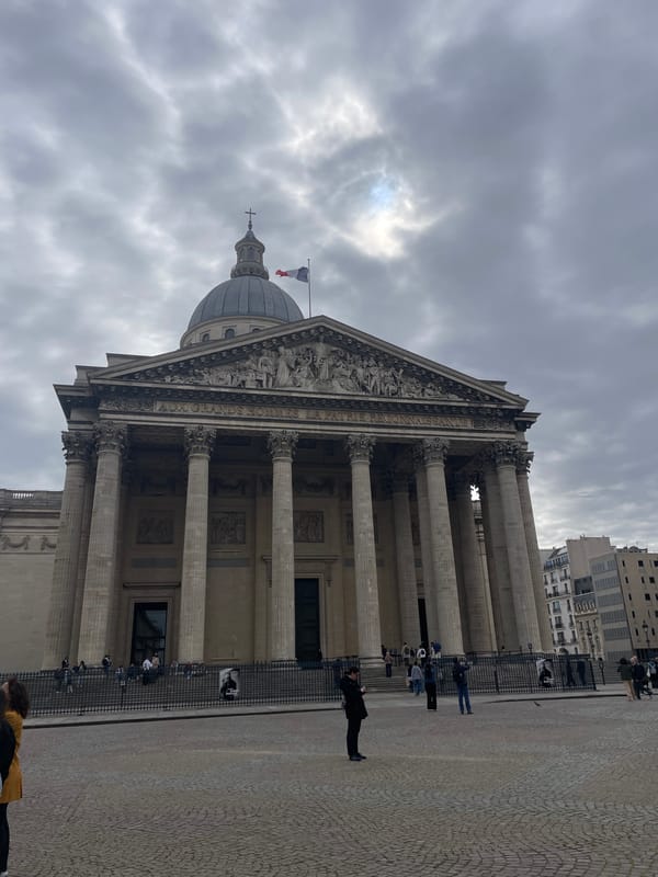 Panthéon observed with French flag and visitors in Paris