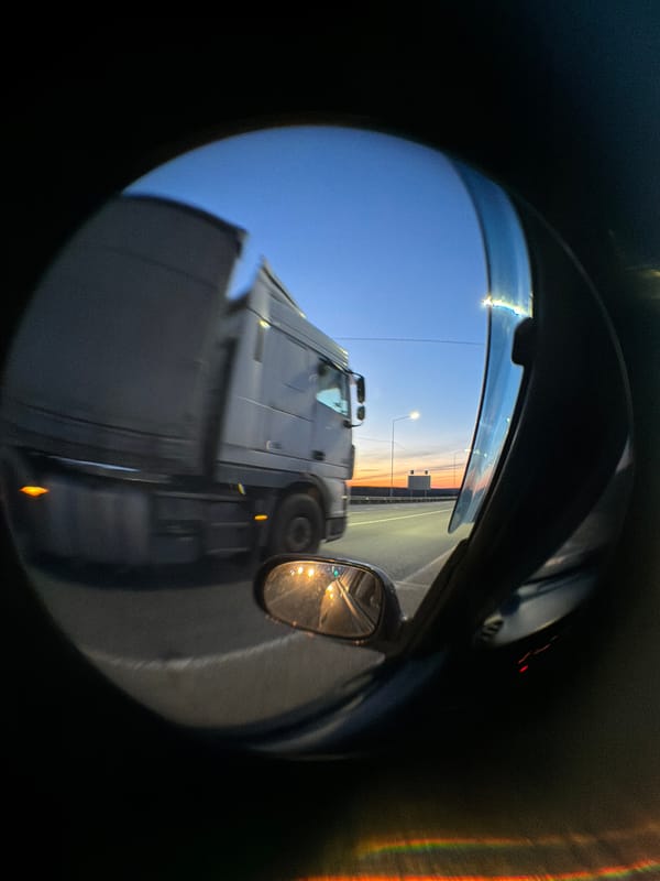 Evening highway traffic captured during sunset near Kuregovo, Russia