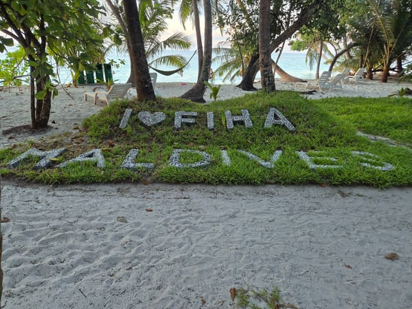 Love message spelled in pebbles on Maldives beach