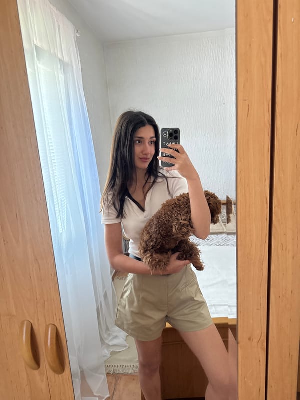 Woman takes selfies with small dog in Montenegro