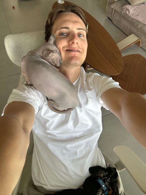 Man poses with sphynx cat in Tel Aviv selfie