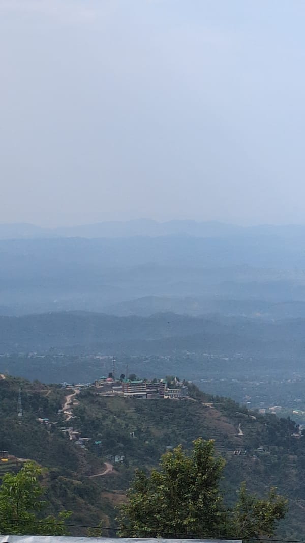 Man pulls rope in mountainous Haini, India before dawn