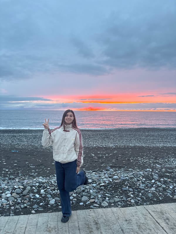 Woman photographed at sunset beach in Batumi, Georgia