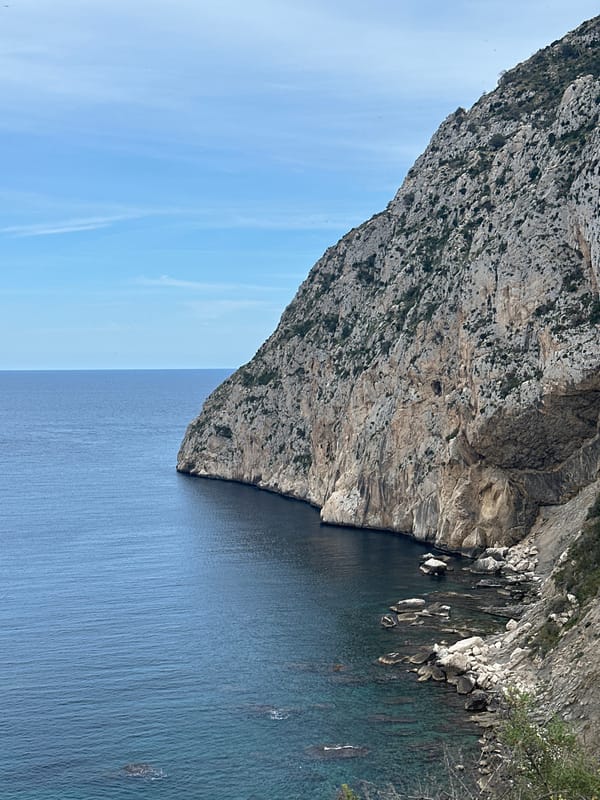 Tourists document iconic Peñón de Ifach cliff from multiple perspectives