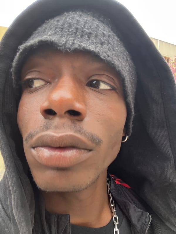 Portrait photos taken in Barcelona show hooded individual