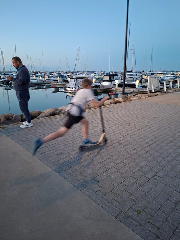 Evening stroll documented at Tallinn waterfront marinas during twilight