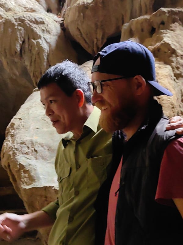 Tourists explore Tam Thanh limestone cave in Vietnam