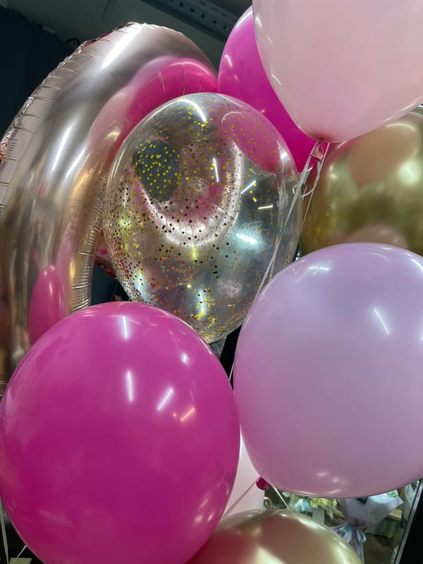 Flower arrangements and balloon preparation documented in Kommunarka, Russia