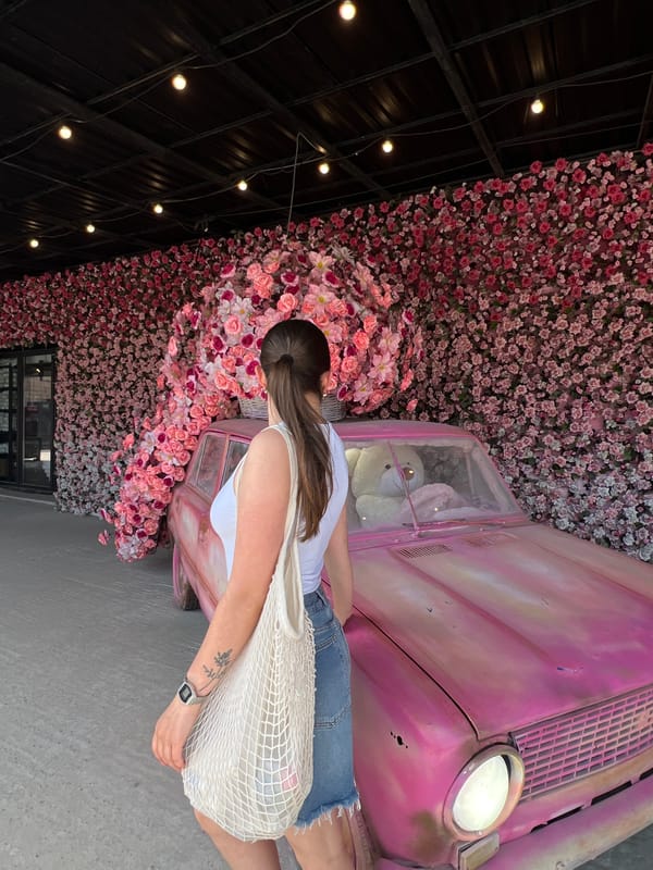 Floral-themed celebration with pink vintage car documented in Ternopil