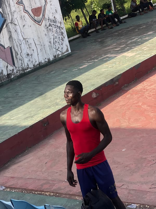 Pickup basketball and downtime at an outdoor court in Jalingo