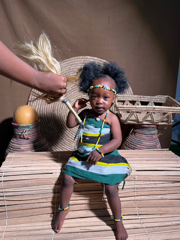 Child poses in traditional Nigerian attire during cultural photo session