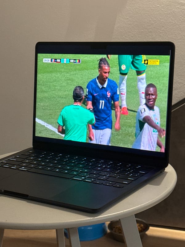 Inside a modern apartment during a soccer match afternoon