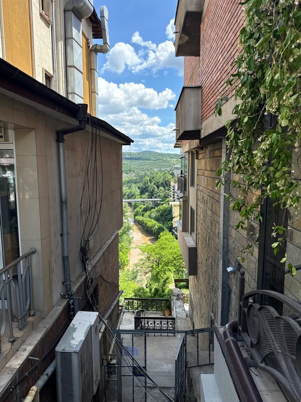 Tourist explores historic Veliko Tarnovo, capturing everyday city scenes