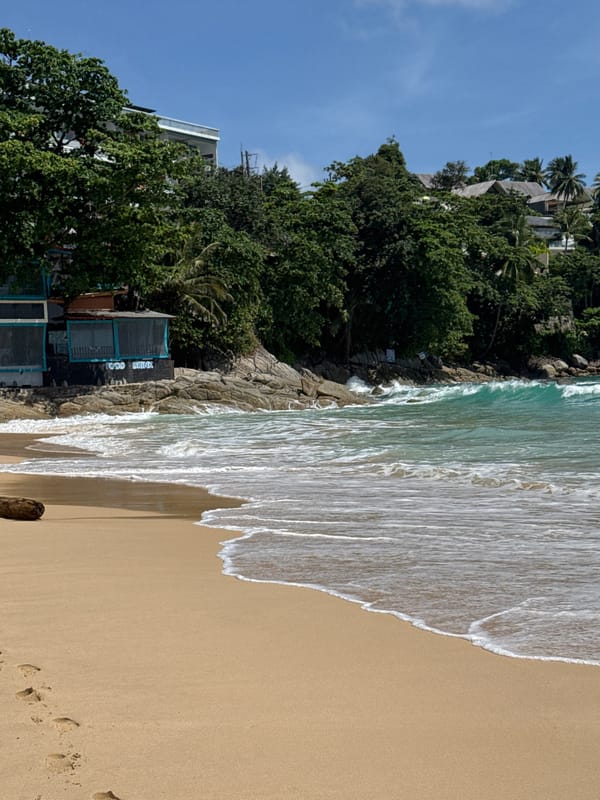 Bang Tao Beach shoreline and surroundings on a sunny Phuket morning