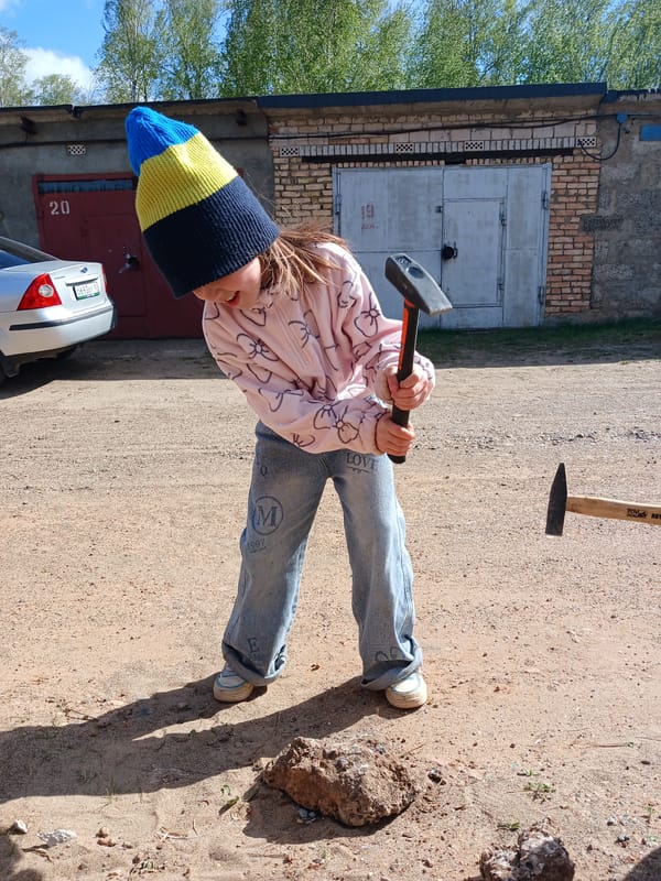 Family car repair day in rural Russian town