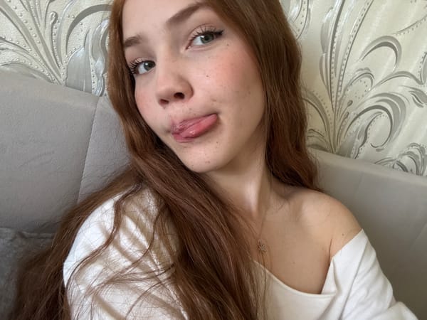 Woman takes multiple photos in Naberezhnye Chelny indoor session
