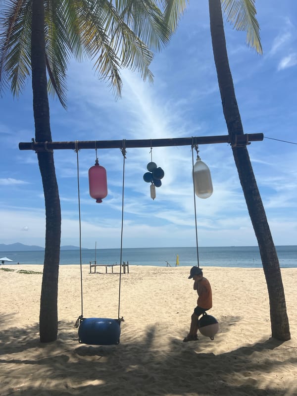 Sun, palms, and beach installations at Hoi An's coastline