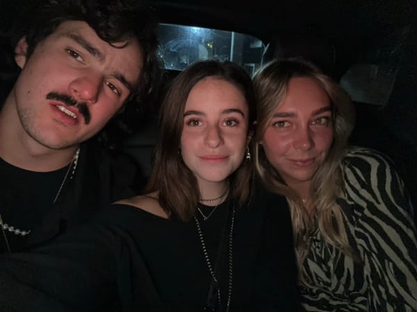 Three friends pose for late-night photo in Mexico City