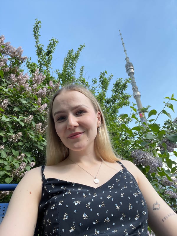 Woman takes spring selfies among lilac blooms in Khimki