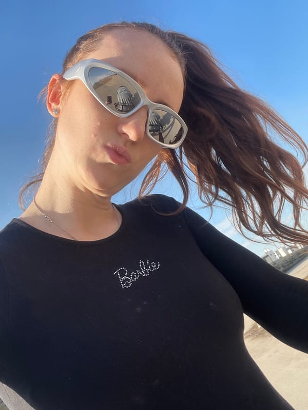 Woman in reflective sunglasses photographed on Russian street