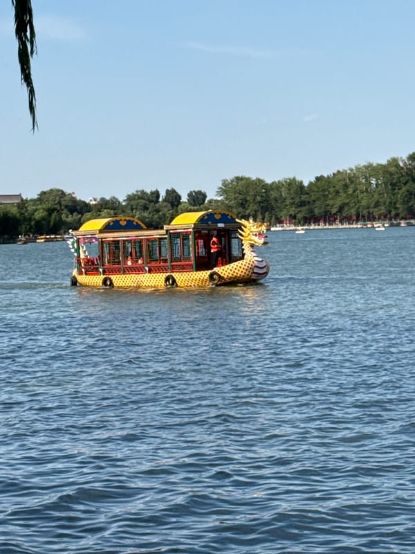 Dragon boats spotted on Beijing lake during morning hours