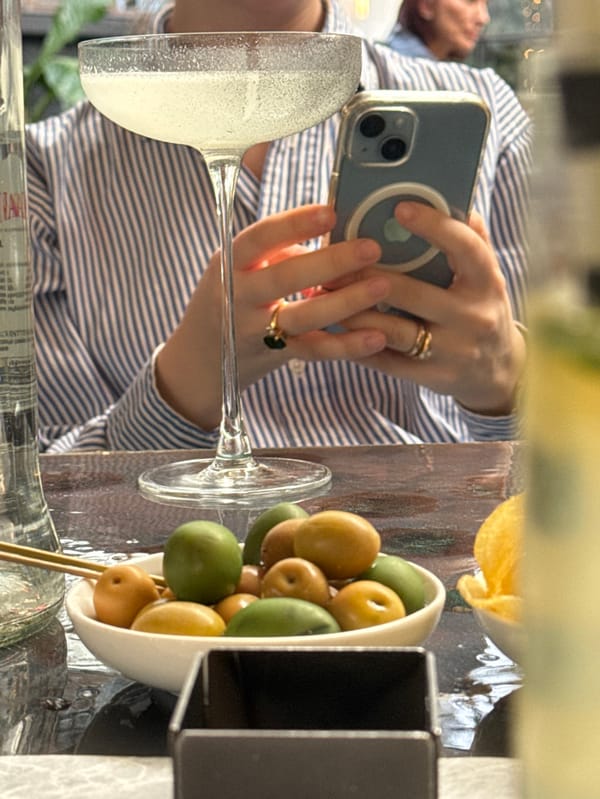 Woman enjoys morning cocktails at Milan restaurant