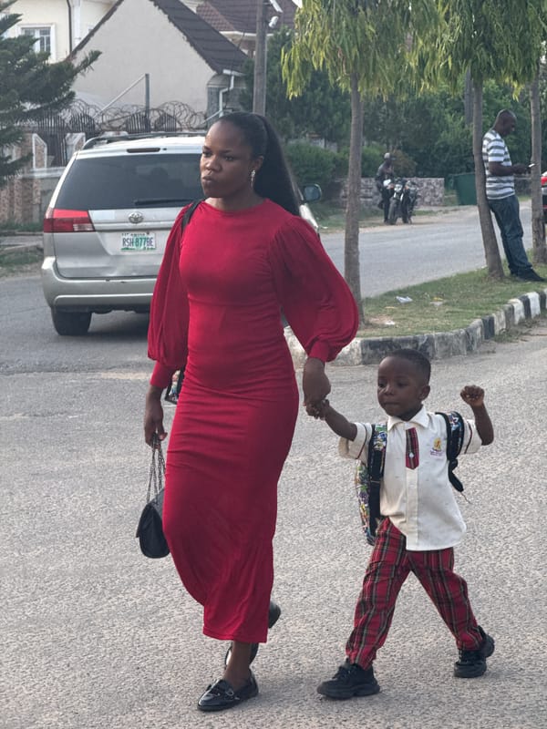 Daily life unfolds on Abuja streets during afternoon hours