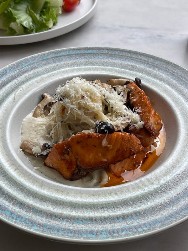 Salmon pasta meal documented in Da Lat, Vietnam