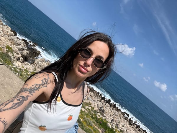 Woman takes seaside selfie along Rethymno coastline