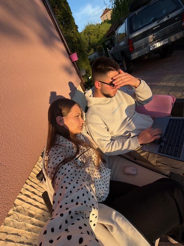 Couple enjoys leisurely afternoon with laptop on Bulgarian patio
