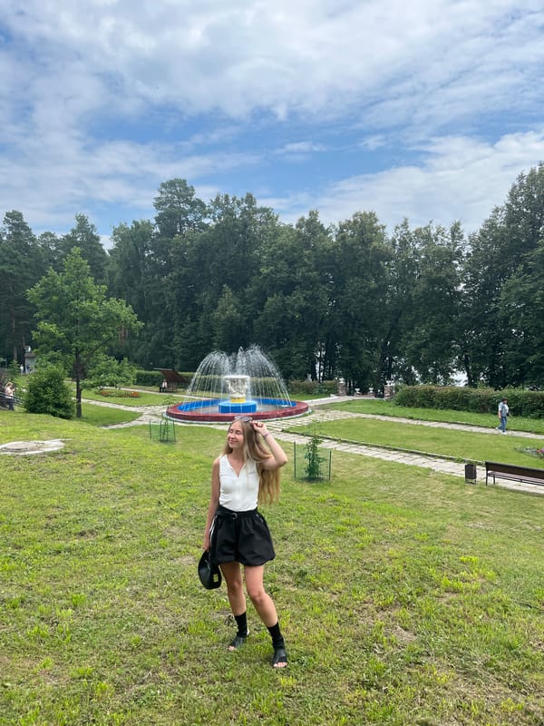 Park fountain scene with a casual nearby presence