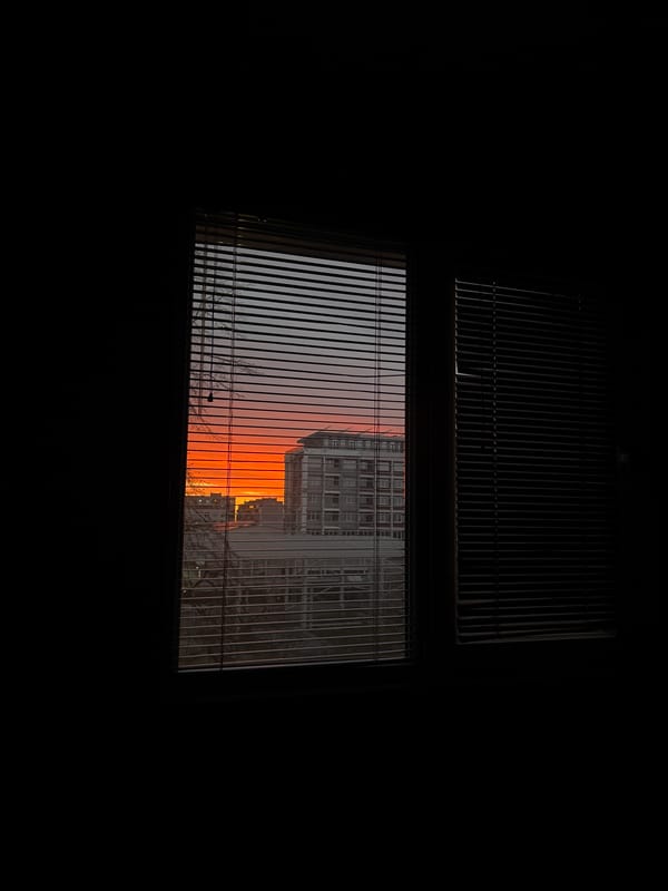 Sunset viewed through barred window in Ruse, Bulgaria