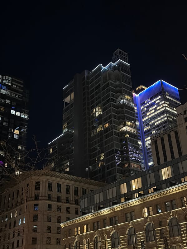 Nighttime Montreal walking tour captures illuminated landmarks and retail stops