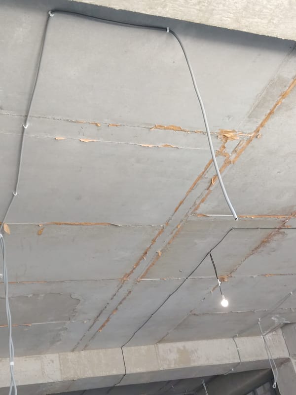 Armenian text displays and concrete ceiling documented in brief sequence