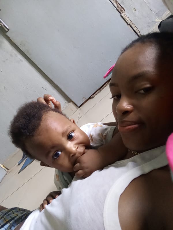 Mother and baby captured in quiet domestic moment in Keffi
