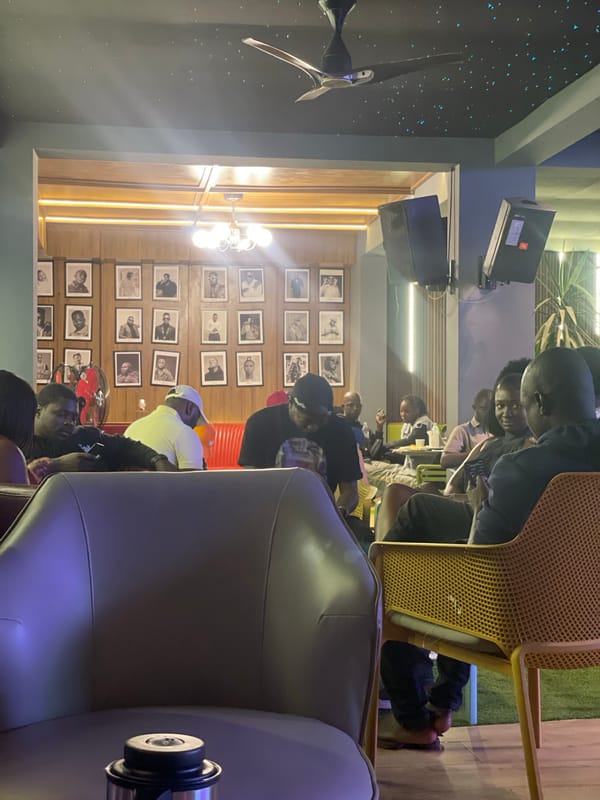 Evening at a Nigerian lounge bar with pool, DJ, and live sport