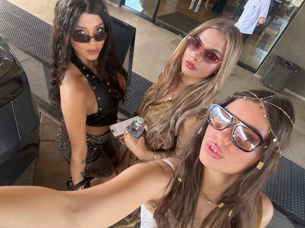 Women pose for selfies in Rancho Mirage desert setting