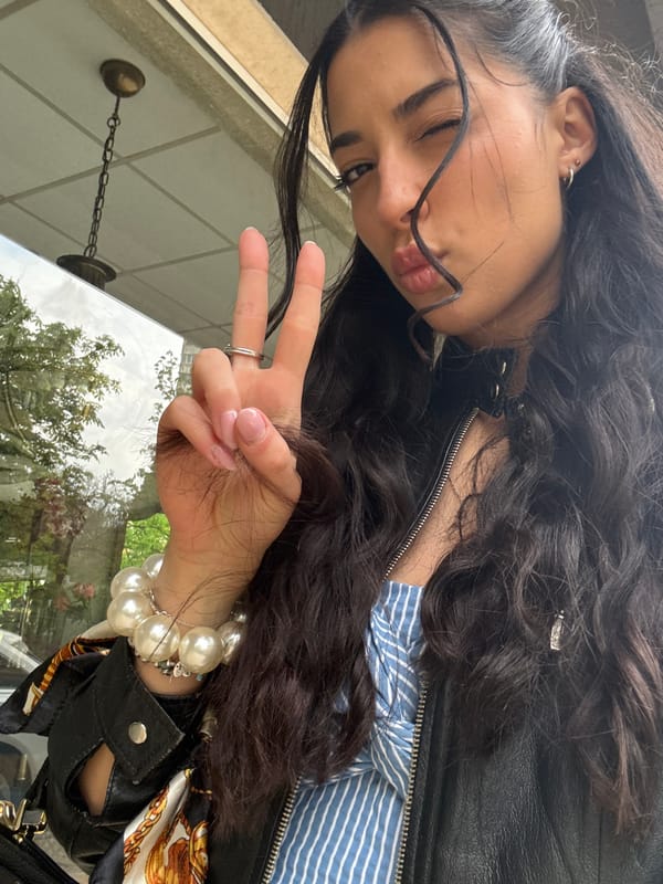 Woman takes playful selfies on Sofia street