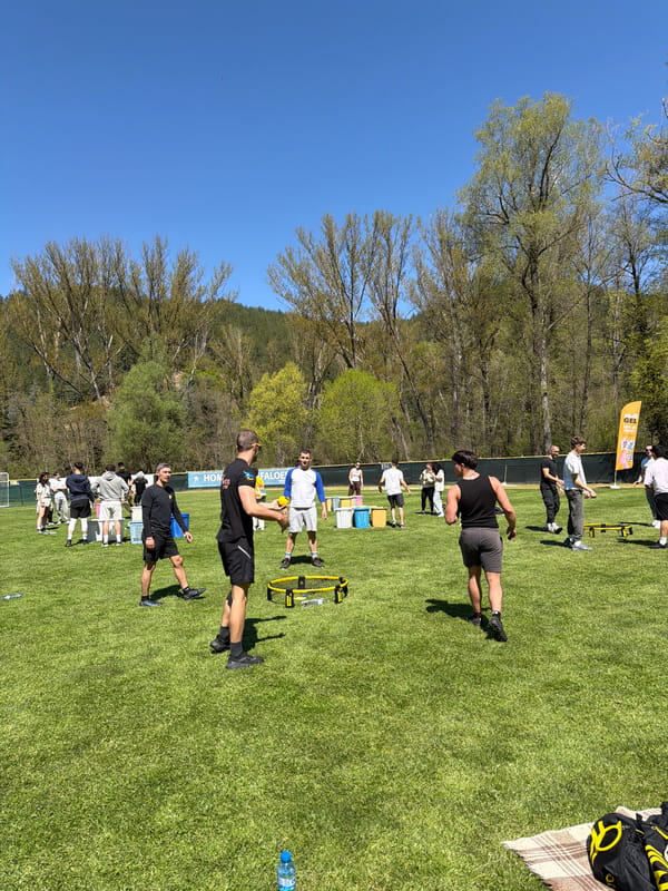 Group plays outdoor games in Bulgarian park on sunny morning