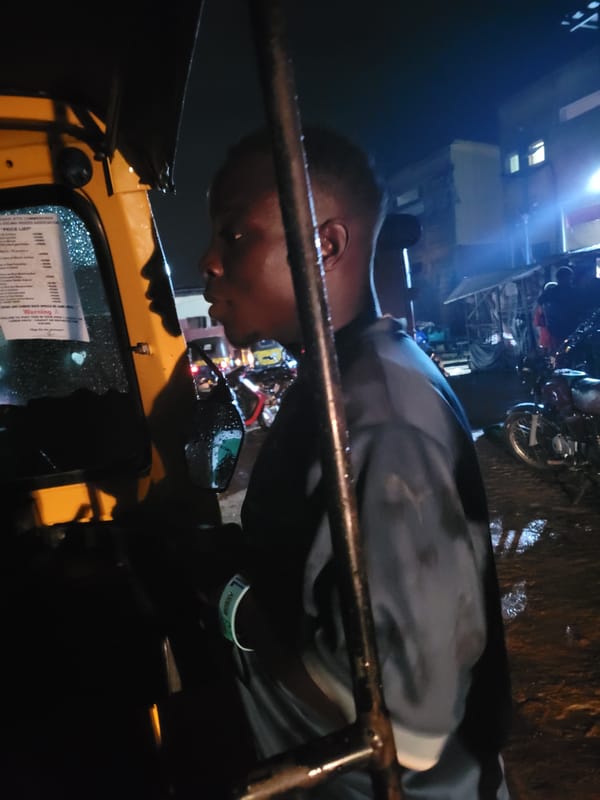 Stormy evening in Egbagu, rain moves in over roadside activity