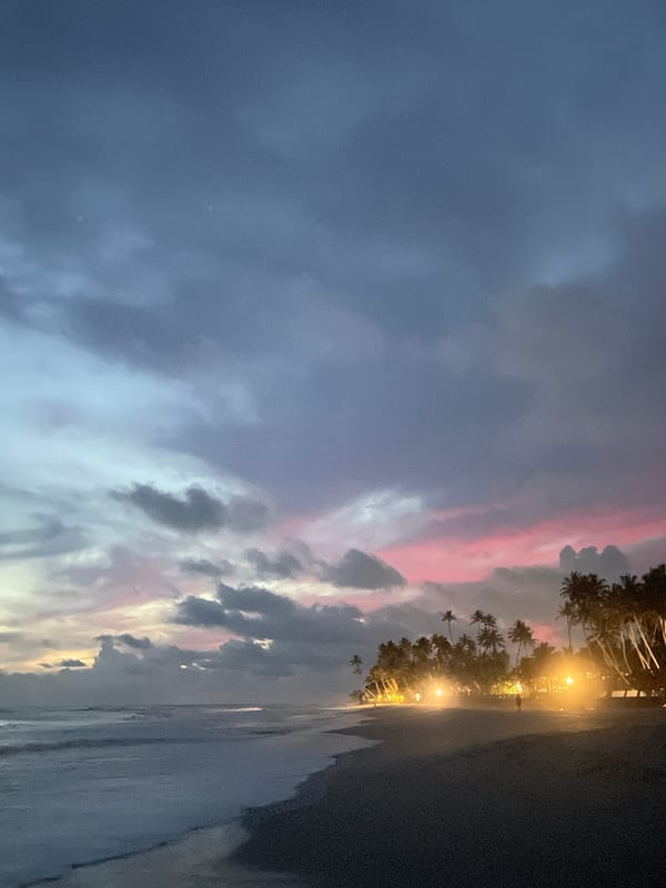 Beach cricket game captured during twilight in Habaraduwa, Sri Lanka