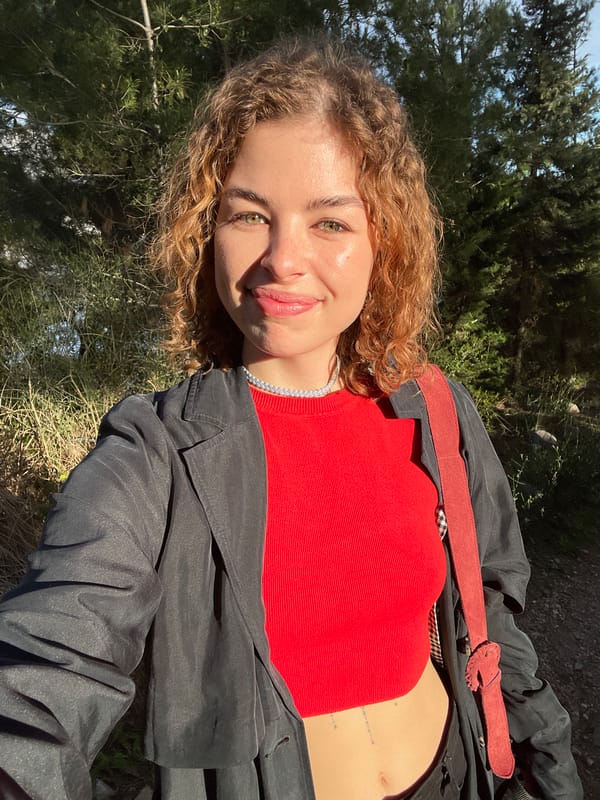 Portrait captured of person in red-belted coat, Budva