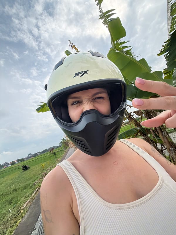 Late-night motorcycle ride captured through North Kuta rice paddies