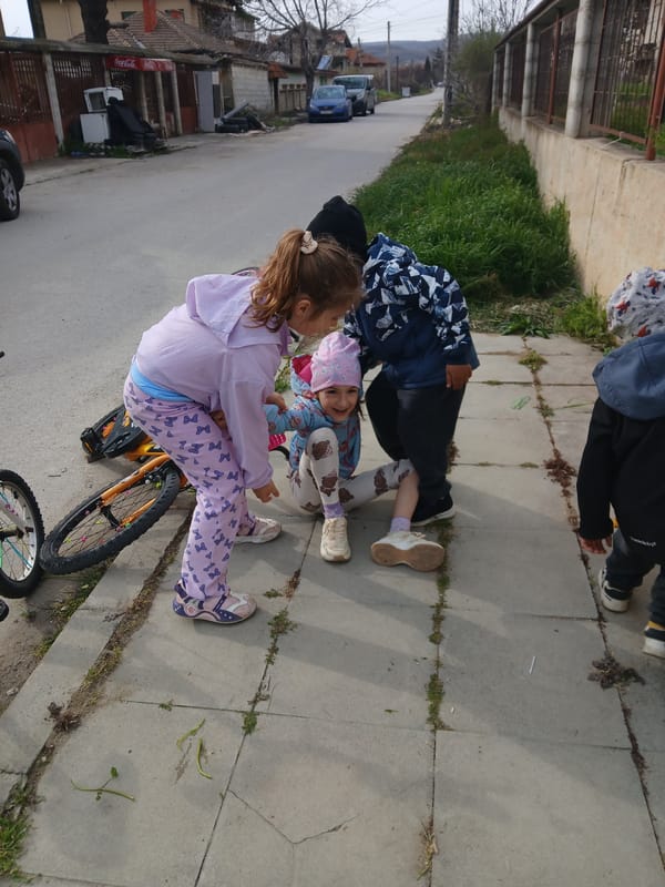 Children play and pose for photos in Obrochishte, Bulgaria