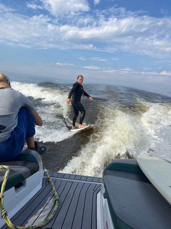 Wake surfing near Saint Petersburg with skyline views