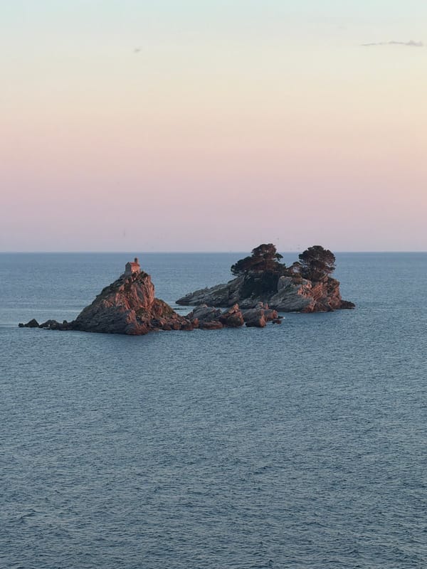 Rocky islet observed off Montenegro coast during evening hours