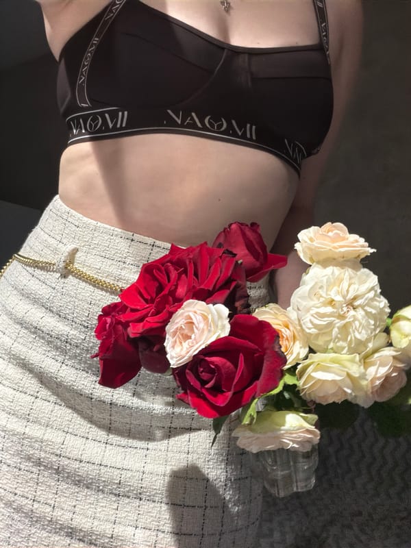 Woman with roses, child building LEGOs captured in Rossiyskiy